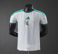 White sports jersey with green and red accents on a black mannequin against a gray background
