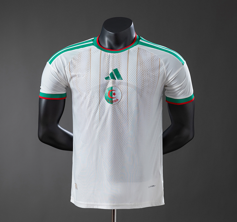 White sports jersey with green and red accents on a black mannequin against a gray background