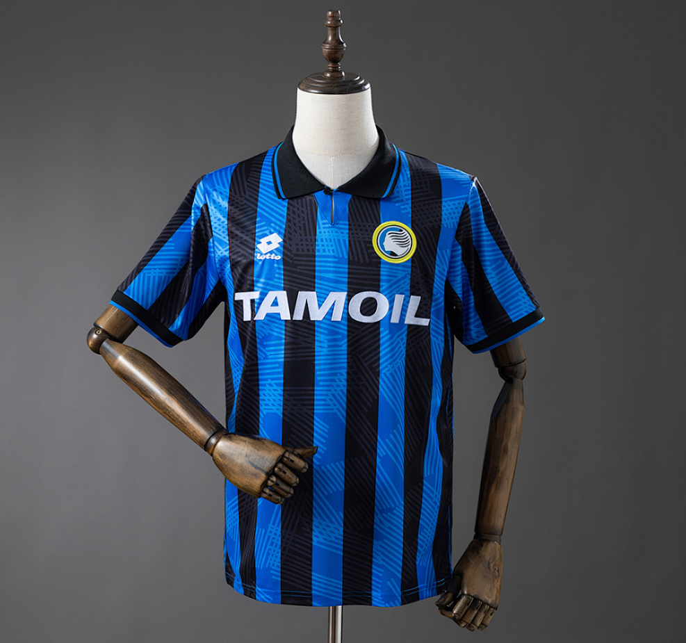 Blue and black striped sports jersey with 'Tamoil' branding on a mannequin against a gray background, Atalanta 91/93 Home Retro Jersey , 11 culture, 11culture, retro jerseys