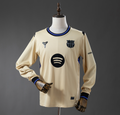 Beige sports jersey with logos on a mannequin against a gray background
