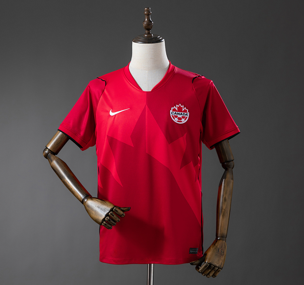 Red sports jersey with Nike logo on a mannequin against a gray background, Canada 2026 Home Jersey, 11CULTURE, 11 CULTURE, ORIGINAL CANADA SOCCER JERSEY