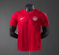 Red sports jersey with Nike logo and Canada emblem on a mannequin against a gray background