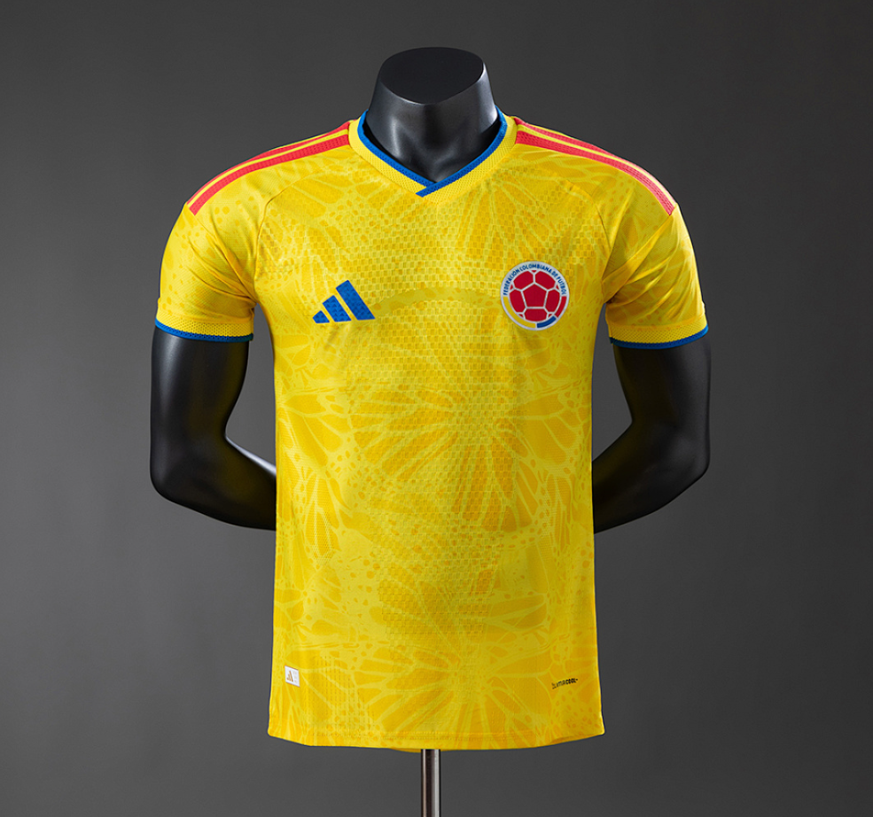 Yellow soccer jersey with Adidas logo on a mannequin against a gray background, Columbia 2026 Home Player Version Jersey. 11 culture, 11culture. original Jersey, football jerseys