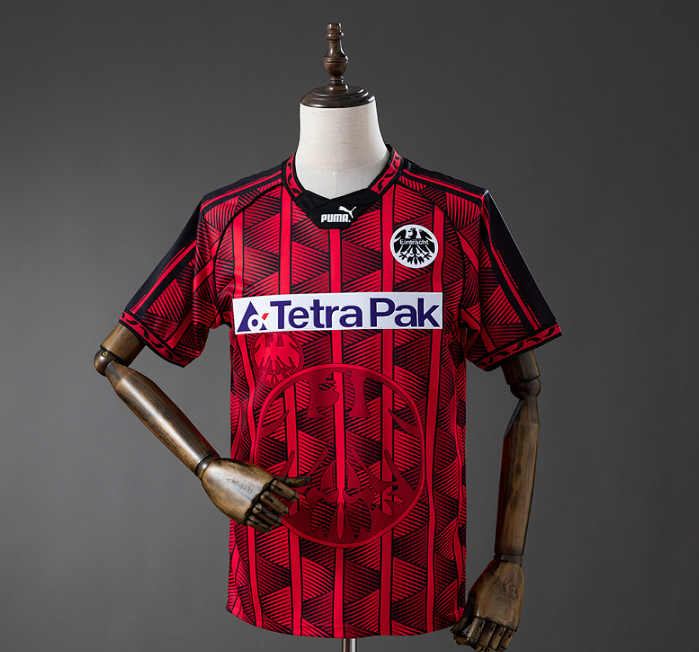 Red sports jersey with Tetra Pak logo on a mannequin against a gray background, 11 culture, 11culture