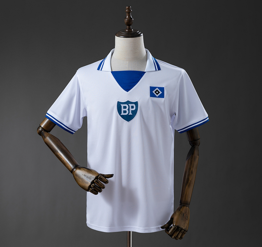 White sports jersey with blue accents on a mannequin against a dark background, Hamburger SV 79/80 Home Retro Jersey , 11culture, 11 culture, sports jersey