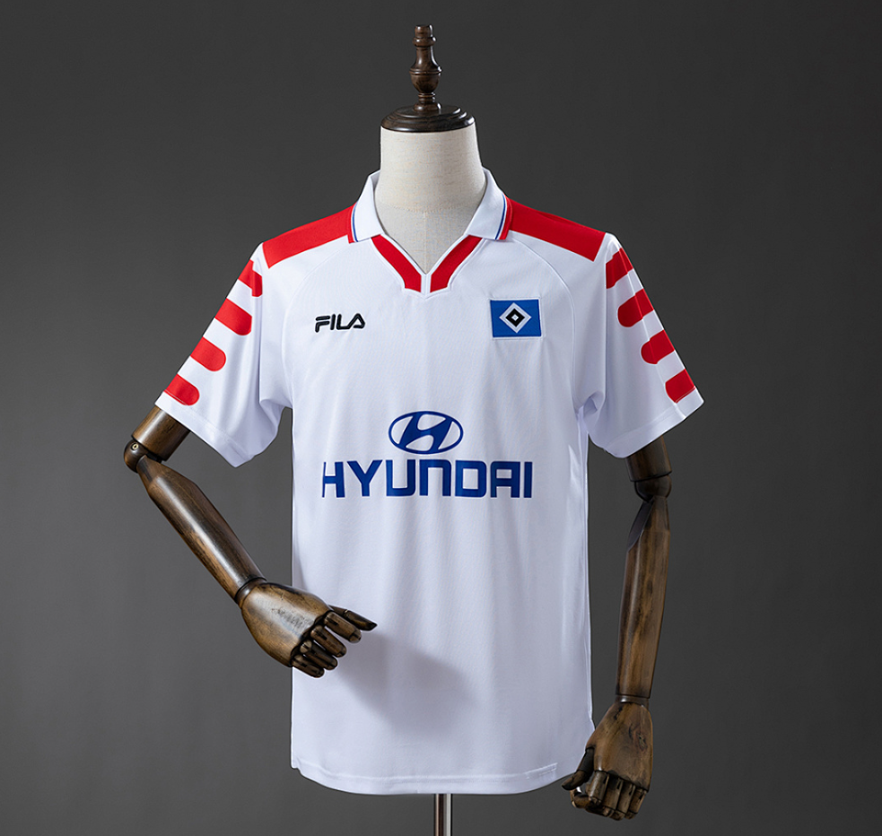 White sports jersey with red accents on a mannequin against a gray background, 11culture, jersey shirts, original jerseys, Hamburger SV 98/99 Home Retro Jersey