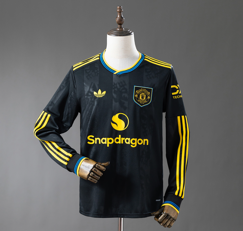 Black sports jersey with yellow accents on a mannequin against a gray background