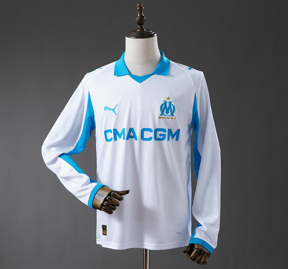 White sports jersey with blue accents on a mannequin against a gray background, Marseille 25/26 Home Long-sleeved Jersey , 11CULTURE, 11 CULTURE