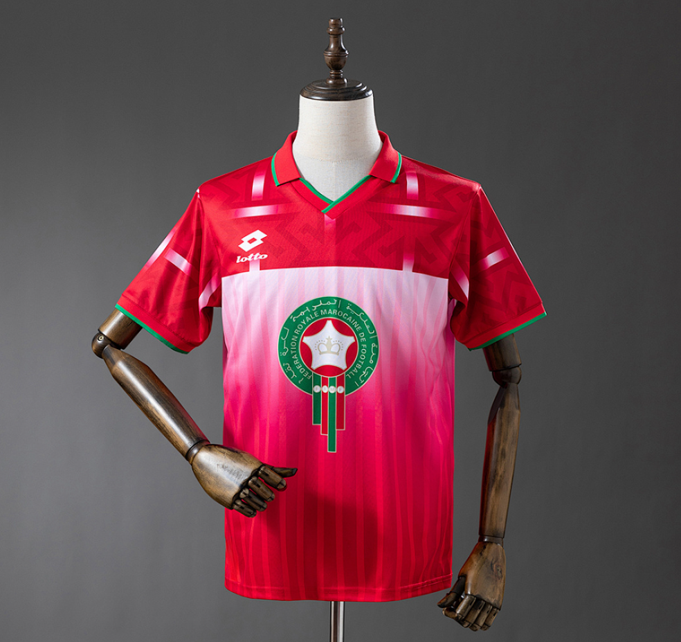 Red and white sports jersey with a logo on a mannequin against a gray background, 11culture, 11 culture, original jerseys