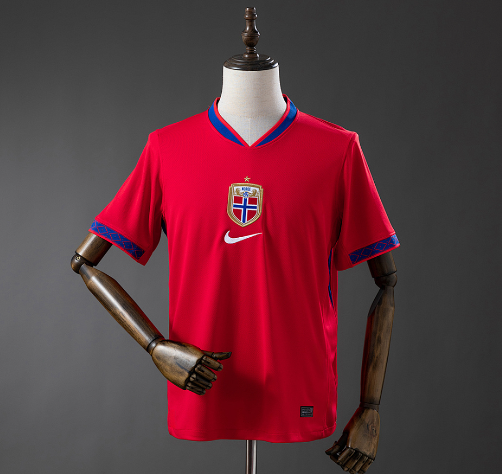 Red sports jersey with a logo on a mannequin against a gray background