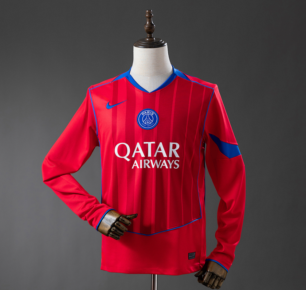 Red sports jersey with Qatar Airways logo on a mannequin against a gray background
