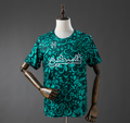 Green patterned t-shirt on a mannequin against a gray background, Palestina 25/26 Special Edition - Green Jersey , palestine footbal jersey, 11culture, 7/11 culture