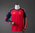 Red and blue sports jersey with yellow accents on a mannequin against a gray background, Spain 2026 Home Long-Sleeve Jersey 