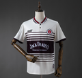 White sports jersey with black stripes and Jack Daniel's branding on a mannequin against a gray background