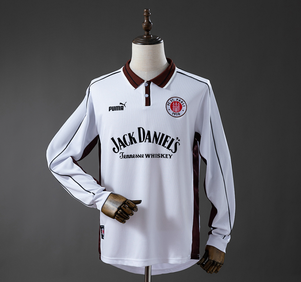 White long-sleeve shirt with Jack Daniel's branding on a mannequin against a gray background