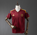 Maroon sports jersey with gold and blue accents on a mannequin against a gray background, Venezuela 2026 Home Jersey , 11 culture, 11culture, original jerseys